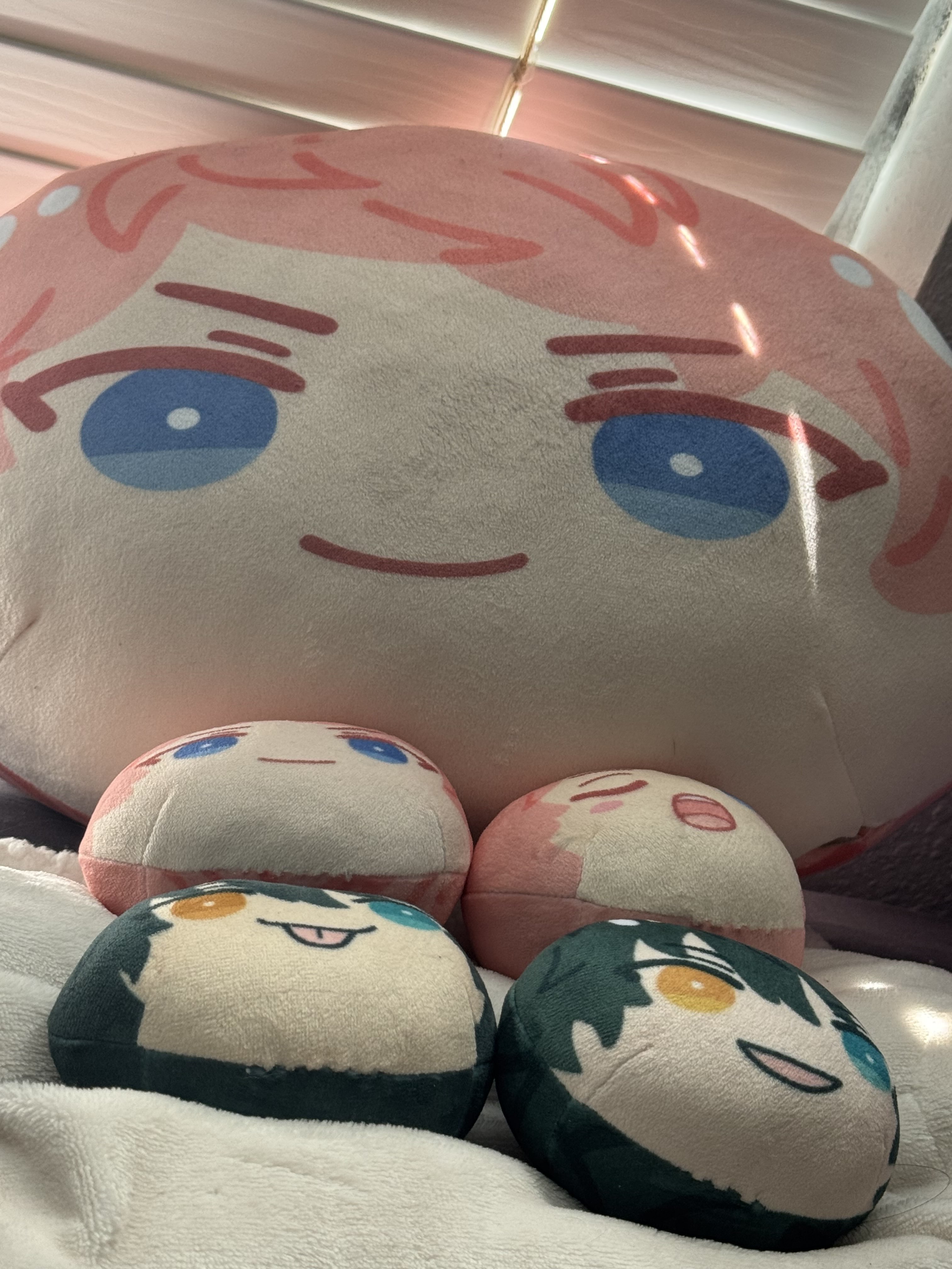 a collection of ball shaped plushies.