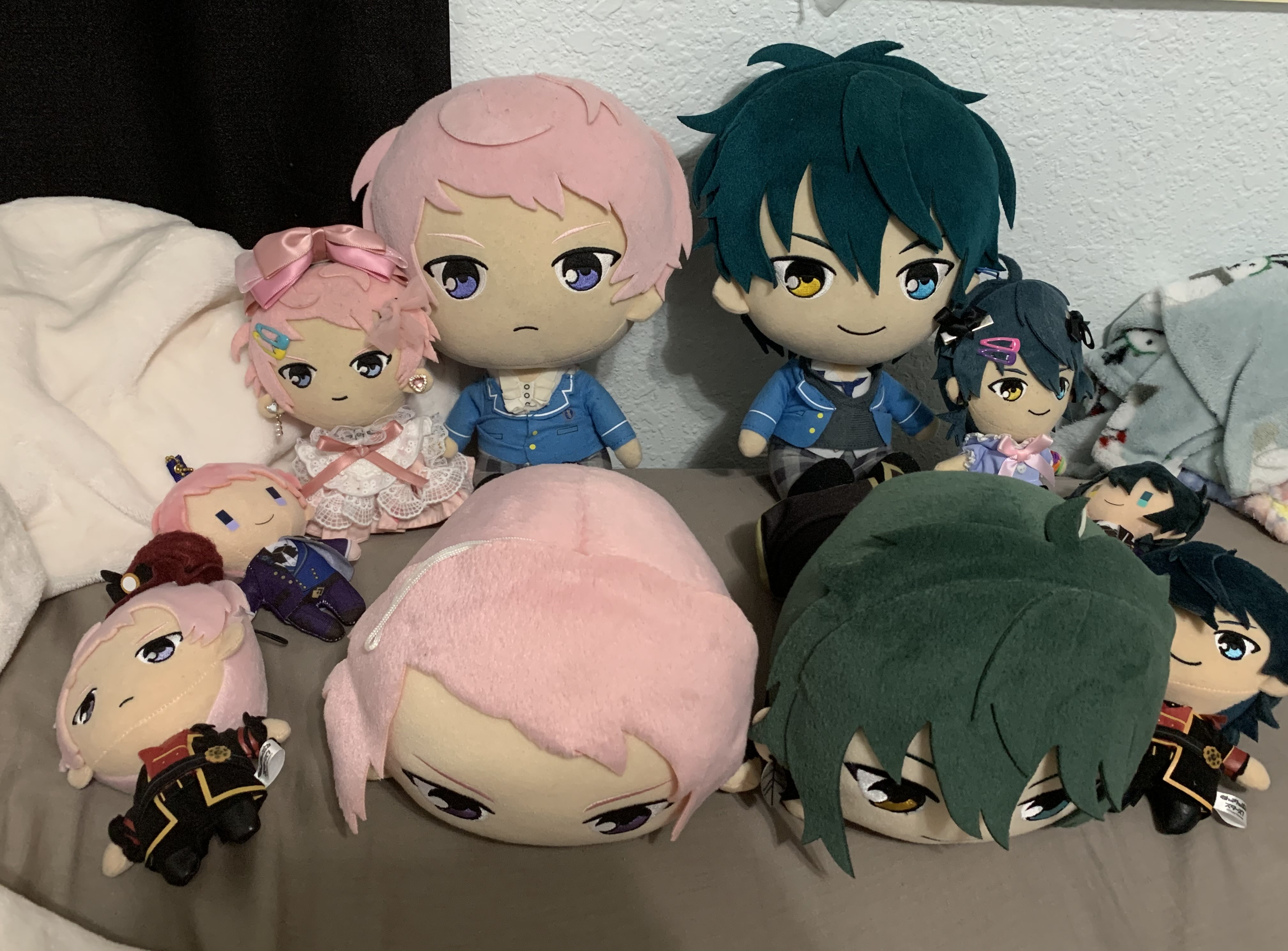 a collection of plushies with big heads.